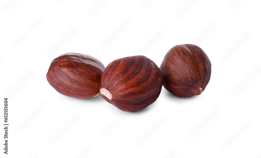 Three delicious hazel nuts isolated on white Three delicious hazel nuts isolated on white