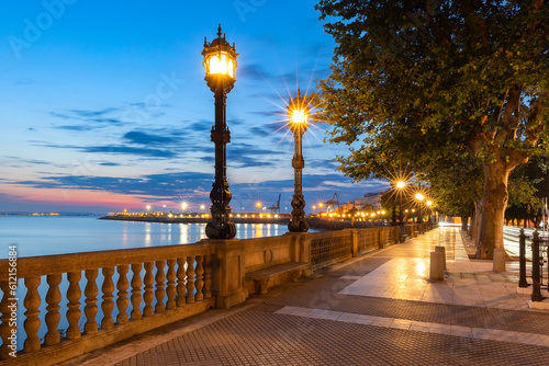 Old Embankment with beautiful lanterns at dawn in Cadiz, Andalusia, Spain