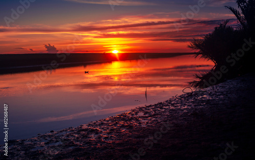 Beautiful dramatic sunset with river 