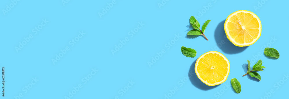 Fresh yellow lemons with mints overhead view - flat lay Fresh yellow lemons with mints overhead view - flat lay