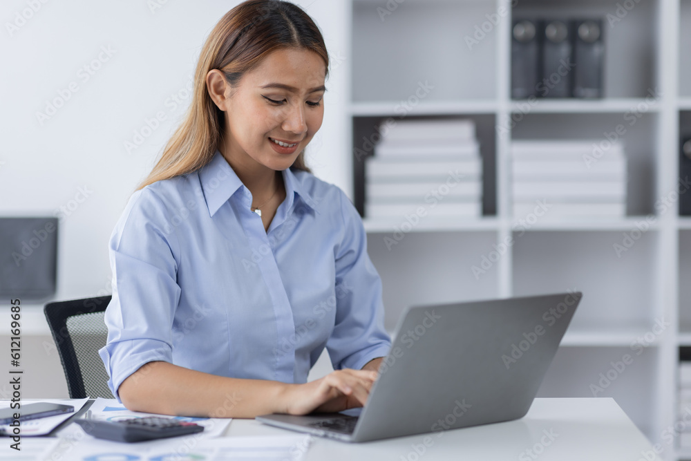 Asian Business woman using calculator and laptop for doing math finance on an office desk, tax, report, accounting, statistics, and analytical research concept
Asian Business woman using calculator and laptop for doing math finance on an office desk, tax, report, accounting, statistics, and analytical research concept
