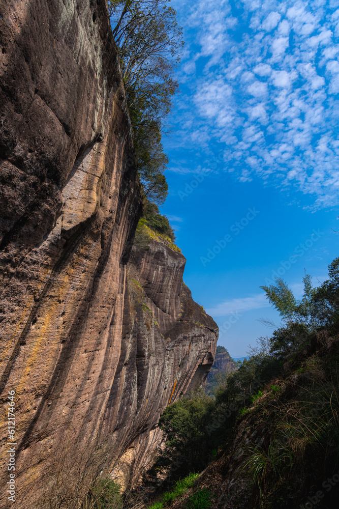 Rocky cliffs rising above the dahongpao tea plantation area of wuyishan china in fujian province.
