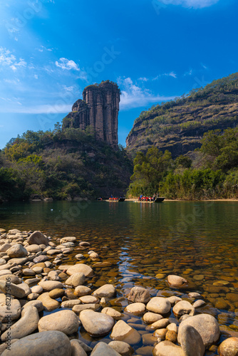 A rocky shore on the nine bend river or Jiuxi in Wuyishan or Mount wuyi scenic area in Wuyi China in fujian province photo