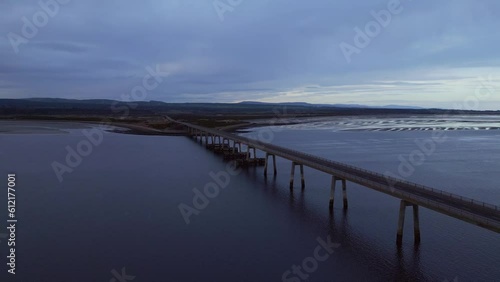 Wallpaper Mural Drone flight towards a magnificent Scottish car bridge, embraced by the vast ocean and crashing waves. Experience the breathtaking union of engineering and natural beauty Torontodigital.ca