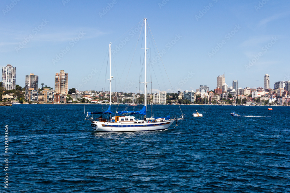 Yacht sailing under power in Sydney Harbour