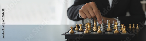 Wallpaper Mural businessman concept, investor holding chess pieces playing chess board game in business competition and risk management plan business strategy leadership concept, copy space, panorama, banner Torontodigital.ca