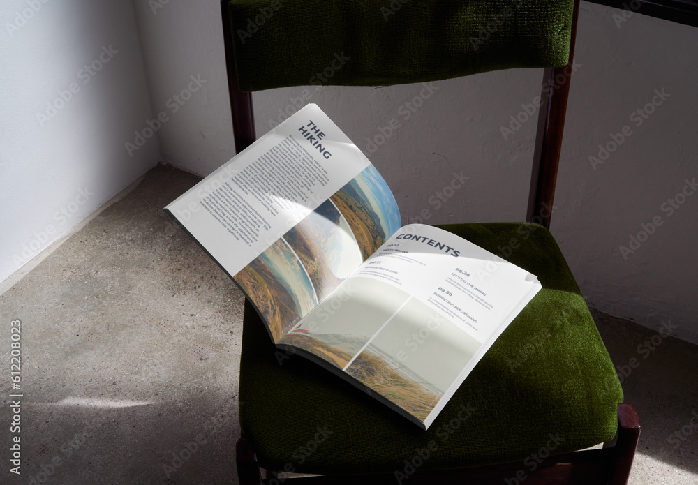 Mockup of open A4 magazine with customizable content against concrete ...