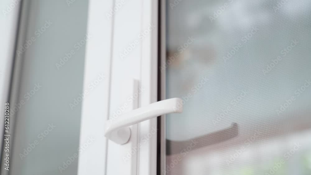They try to open the closed plastic door by force. From the inside, a crooked man is trying to open the door, outside view. Nervous visitor breaks the door, close-up They try to open the closed plastic door by force. From the inside, a crooked man is trying to open the door, outside view. Nervous visitor breaks the door, close-up