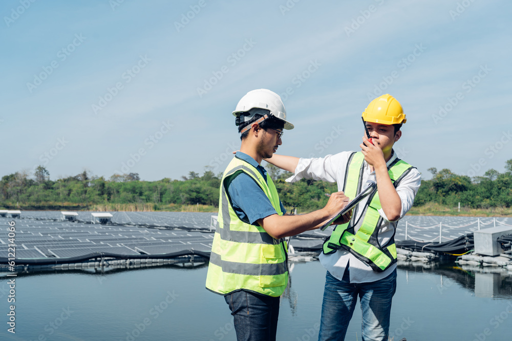 Team of engineers wearing a uniform inspect and check solar cell panel, solar cell is smart ecology energy sunlight alternative power factory concept. Team of engineers wearing a uniform inspect and check solar cell panel, solar cell is smart ecology energy sunlight alternative power factory concept.