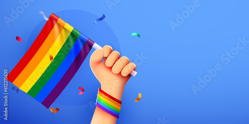 Hand holds LGBT rainbow flag. Pride month banner. People's rights movement, diversity concept.