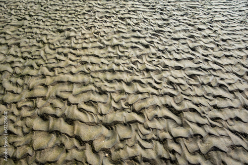 sand patterns made when the wave goes out on the beach