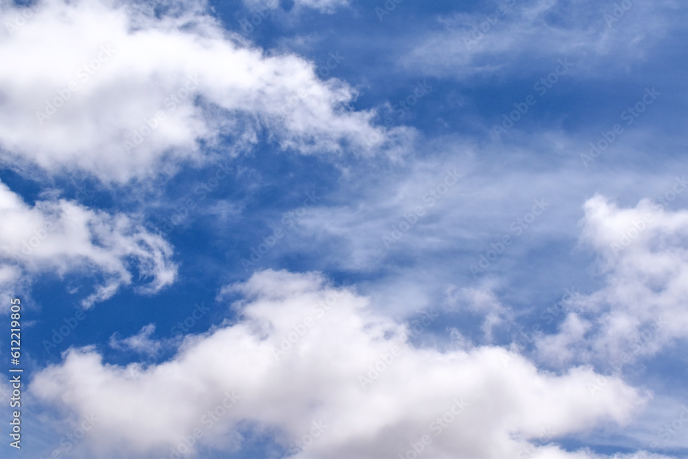 Blue sky with white fluffy clouds. Cumulus clouds background. Cloudscape morning sky. The concepts of freedom of live, never give up and positive though energy. Blue sky with white fluffy clouds. Cumulus clouds background. Cloudscape morning sky. The concepts of freedom of live, never give up and positive though energy.