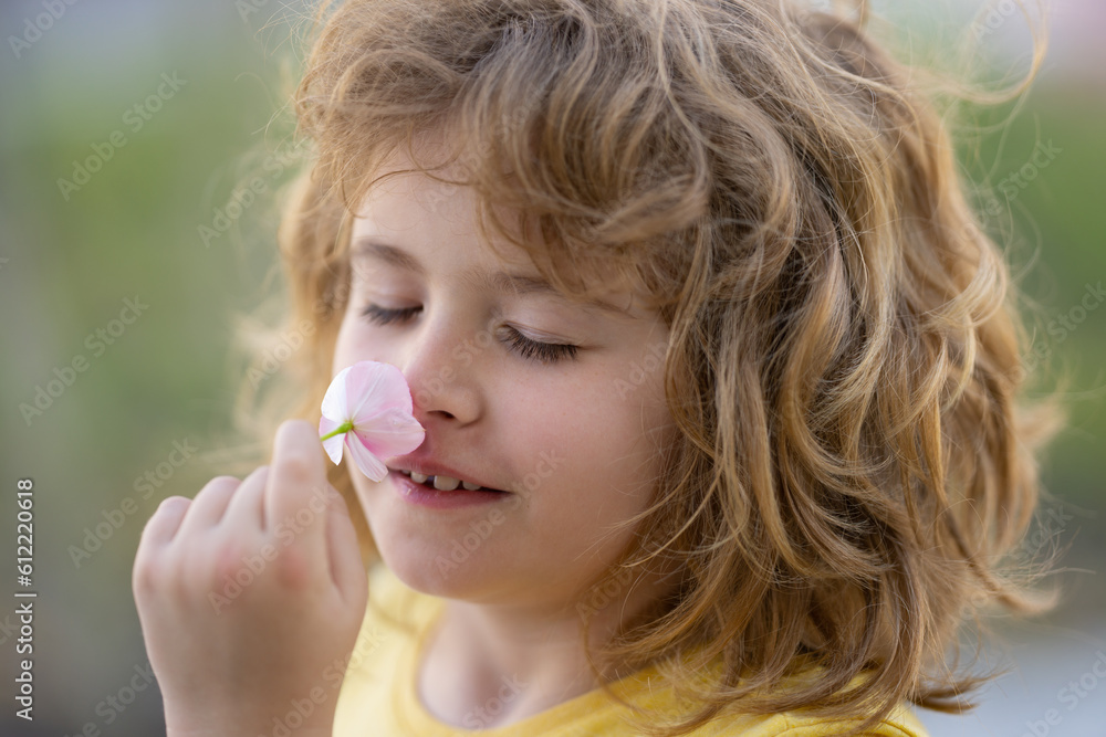 Kids smelling summer flower, closeup face. Funny child face close up. Kids head portrait. Close up faces kid. Funny kids face. Portrait cute boy. Head shoot kids portrait outdoor. Kid enjoying nature. Kids smelling summer flower, closeup face. Funny child face close up. Kids head portrait. Close up faces kid. Funny kids face. Portrait cute boy. Head shoot kids portrait outdoor. Kid enjoying nature.