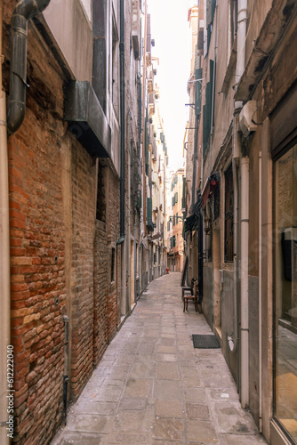Fototapeta Naklejka Na Ścianę i Meble -  View of a narrow street in Venice