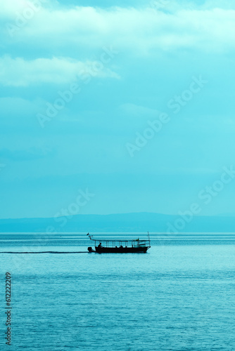 Canvas Print Silhouette of sailing boat at Kvarner bay of Adriatic sea in summer morning