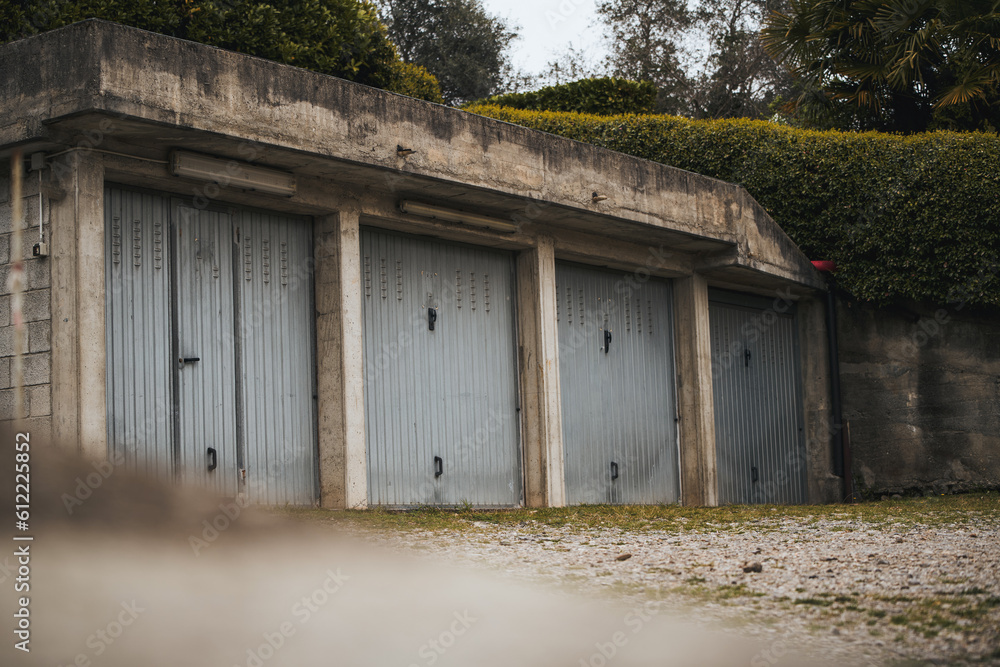 Garage concept. Closed garage doors. Exterior view of a beautiful house with garage gate. Garage concept. Closed garage doors. Exterior view of a beautiful house with garage gate.