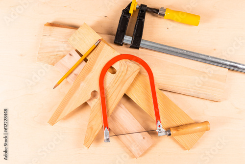 Carpentry Profession Ideas. Variety of Separate Lineup of Assorted work tools on wood.