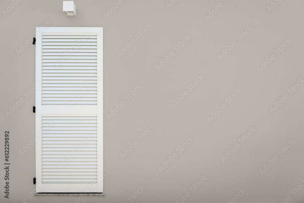 Facade of modern house, door with shutter Facade of modern house, door with shutter
