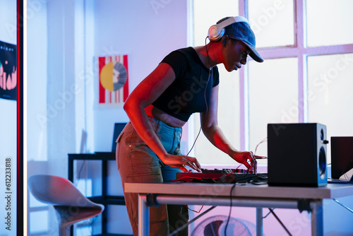 DJ operating sound mixer at home photo