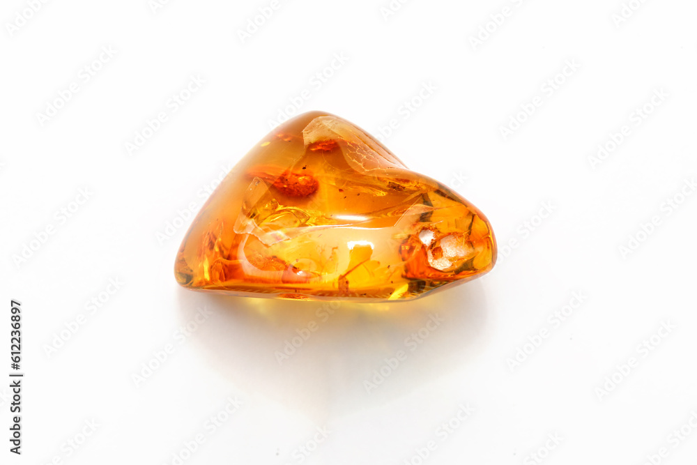 Amber bubbles with inclusions a white background. Sun stone. Fossil fossilized resin. semi-precious mineral. Natural material for jewelry. Copal. Science and geology. Insects in amber stone.