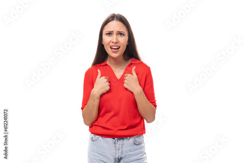 young excited brunette lady dressed in a red t-shirt on a white background