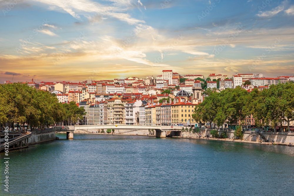 The famous buildings of the Croix Rousset district on a hill in Lyon, France, are visible from the Saone River