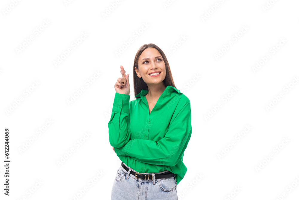 smart well-groomed brunette long-haired young woman in a green shirt on a white background with copy space smart well-groomed brunette long-haired young woman in a green shirt on a white background with copy space