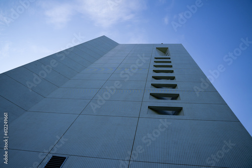 View from below of modern office building with sky above. wide angle shot of tall business buildings
