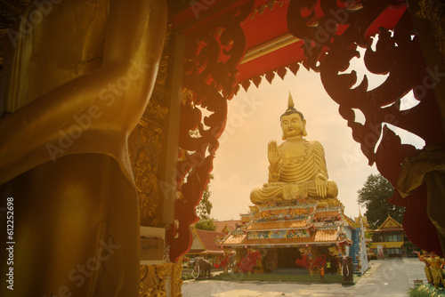 Pra Put Ratanamani Srihathai Naresuan or Luang Por Pan Lan large golden sitting outdoor Buddha in Wat Maniwong. It is a beautiful and faithful Buddha image. Located at Nakhon Nayok Province in Thailan photo