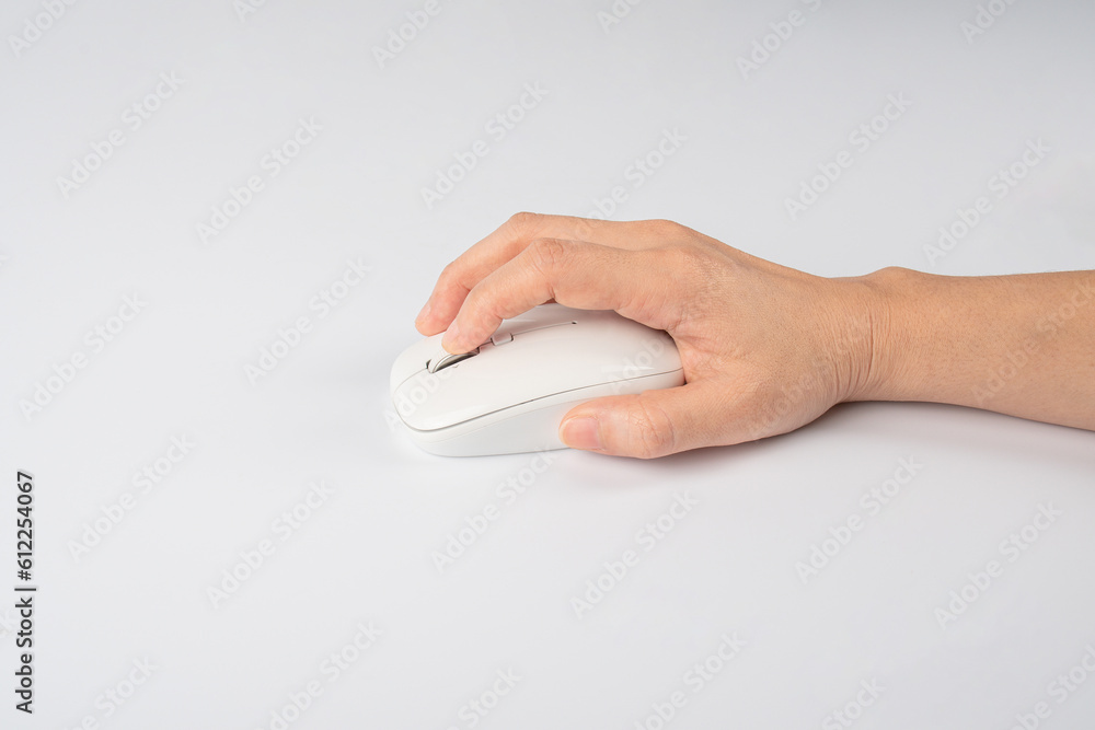 Hand click on modern computer mouse isolated on a white background Hand click on modern computer mouse isolated on a white background