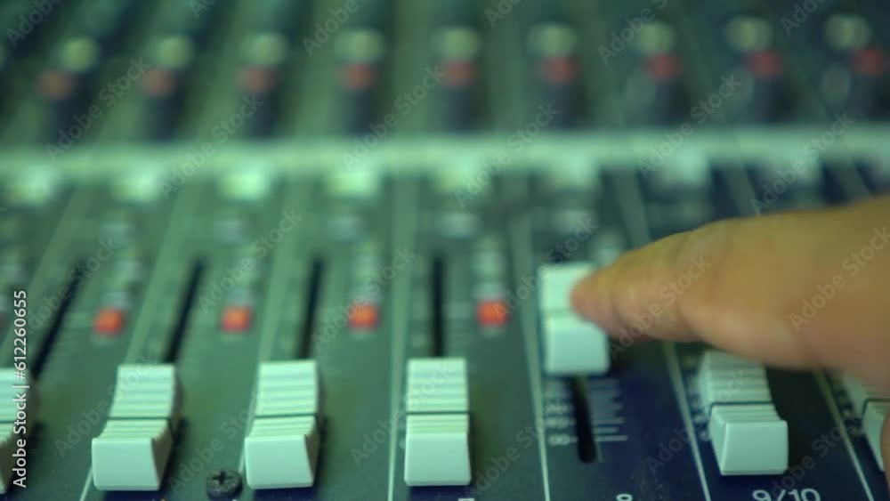 Music Mixer desk table in recording studio. Musician tunes electronic