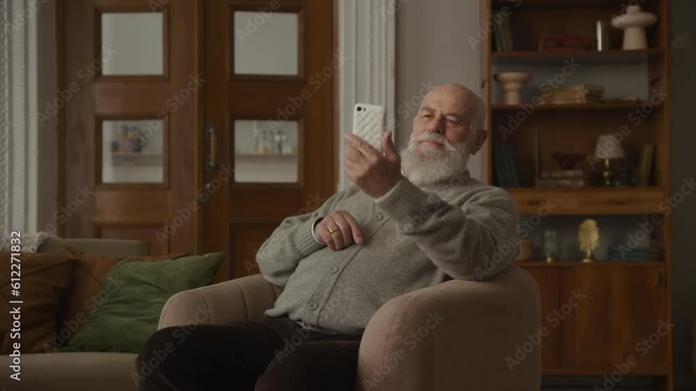 Elderly Man Celebrating an Achievement on Smartphone Elderly Man Celebrating an Achievement on Smartphone
