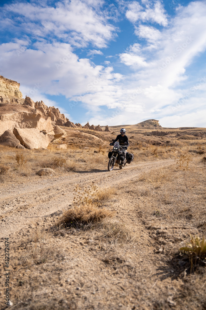 Man riding his Yamaha Tenere 700 motorcycle in Cappadocia, Turkey