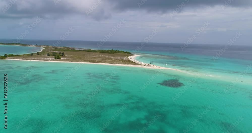 Tropical island with sandbank, CAYO DE AGUA Los Roques RAINY DAY , AERIAL SHOT PAN RIGHIT Tropical island with sandbank, CAYO DE AGUA Los Roques RAINY DAY , AERIAL SHOT PAN RIGHIT