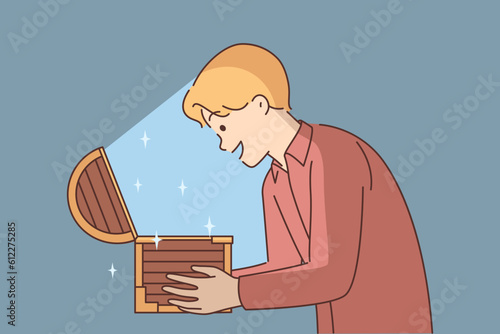 Man with open chest filled with treasures or jewels for concept of lucky find and luck