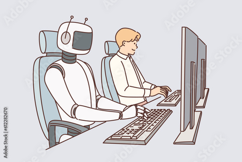 Robot works on computer and among people for concept introducing artificial intelligence in business
