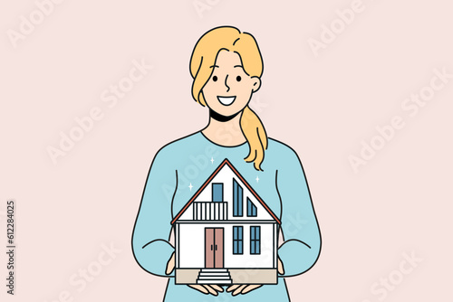 Smiling woman broker holding house maquette in hands selling to customer. Happy female real estate agent offer housing on sale. Vector illustration. 
