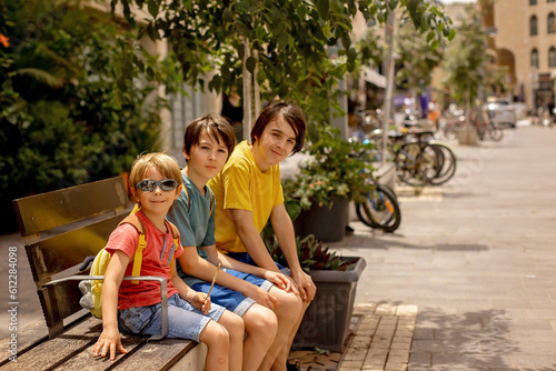 European tourist family with children, visiting Tel Aviv, Israel, enjoying day walk