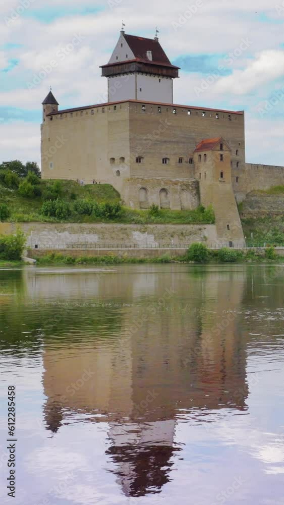 Castle by a river, reflection, vertical short video Castle by a river, reflection, vertical short video