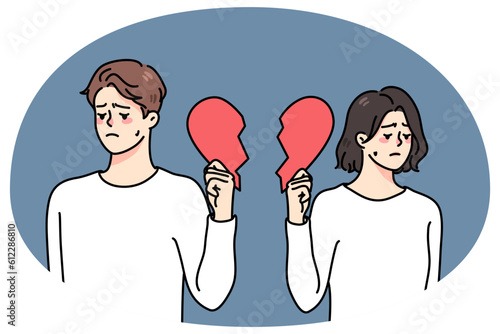 Unhappy couple holding pieces of broken heart suffer from breakup or divorce. Sad upset man and woman struggle with split or separation. Relationships over. Vector illustration.
