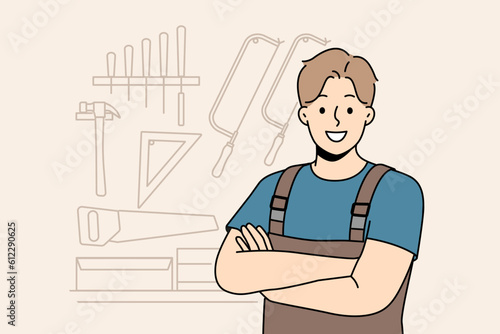Smiling male carpenter in unform and glasses in workshop. Happy craftsman posing in woodwork workroom. Vector illustration. 