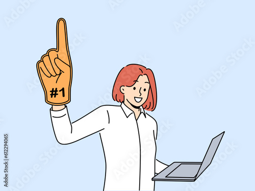 Woman leader with laptop and giant champion hand symbolizing success in internet career. Ambitious girl wants to become leader by working as freelancer through computer or creating online startup.