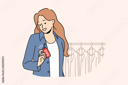 Smiling woman wearing jacket with sale tag in boutique. Happy girl buying clothes on discount or promotion in store. Shopping and style. Vector illustration. 