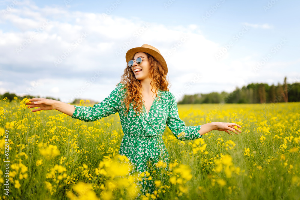 Beautiful woman in the blooming field. Nature, vacation, relax and lifestyle. Summer landscape. Beautiful woman in the blooming field. Nature, vacation, relax and lifestyle. Summer landscape.