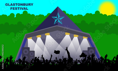 the Glastonbury stage with silhouettes of people watching the festival. Held every year at Worthy Farm in Pilton, Somerset, U.K. commemorate Glastonbury Festival
