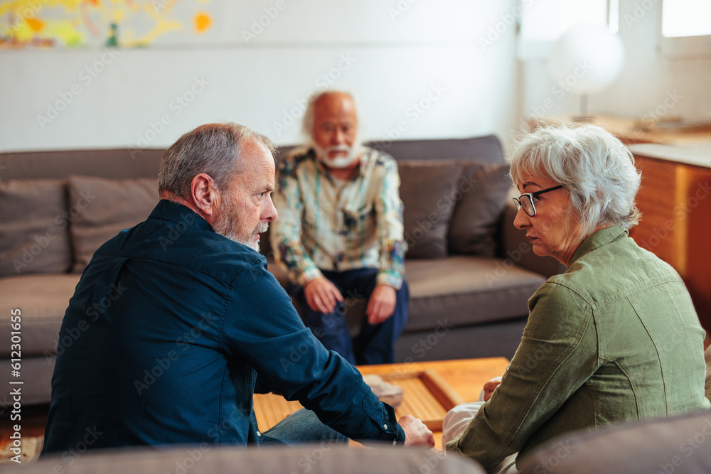 Rare view of senior couple having marriage therapy at psychologist office. Rare view of senior couple having marriage therapy at psychologist office.