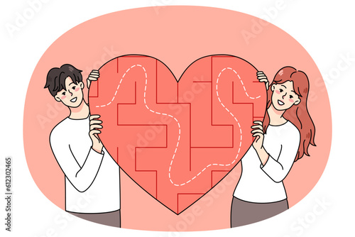 Happy young couple with heart symbol with labyrinth inside search love. Smiling man and woman look for relationships. Dating application and service. Flat vector illustration.