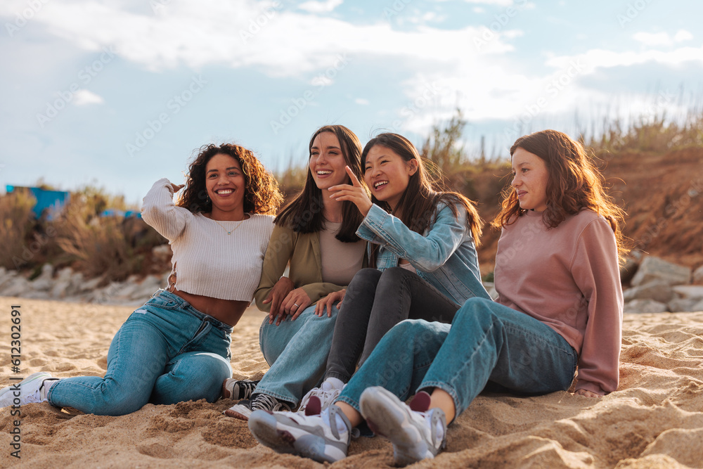 Diverse female group having fun on beach Diverse female group having fun on beach