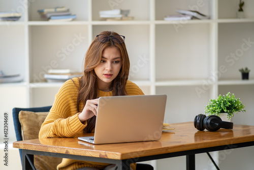 Distance Education. E-learning, Study online, Smiling beautiful woman sitting at desk and wearing headphone head set study online class zoom google meet discord, Happy engaged girl attending for learn