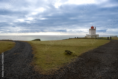 Dyrholaey Lighthouse, Atlantic ocean and cloudy sky, Iceland